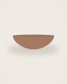 Arco Low Bowl in Clay, front view on a neutral backdrop