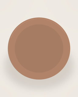 Arco Round Serving Plate in Clay, front view on a neutral backdrop