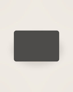 Tela Linen Placemat in Charcoal, front view on a neutral backdrop